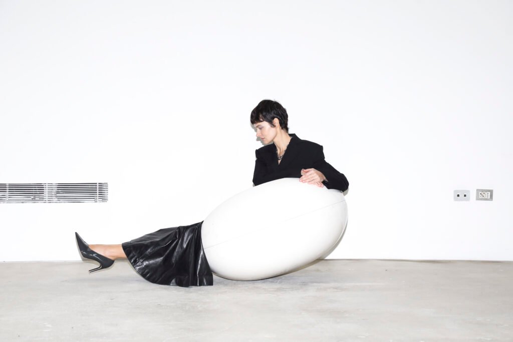 jacket & skirt SPORTMAX, necklace GIOVANNI RASPINI, shoes SERGIO ROSSI